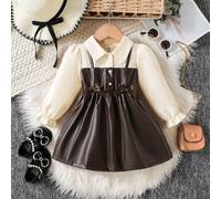 Robe A-line à manches bouffantes pour bébés filles. Silhouette classique A-line convenant à différents types de morphologie de bébé. Le design distinctif du col ajoute une touche de formalité, tandis 