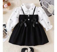 Robe A-line à manches bouffantes pour bébés filles. Silhouette classique A-line convenant à différents types de morphologie de bébé. Le design distinctif du col ajoute une touche de formalité, tandis 