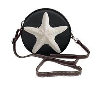 Sac bandoulière rond en cuir pour femme, orné d'une étoile de mer blanche unique.