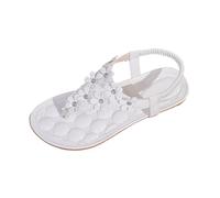 Sandales plates bohèmes à fleurs pour la plage, parfaites pour une garden-party estivale décontractée. Cuir ou synthétique
