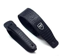 Sangle en cuir synthétique gaufré conçue pour les guitares acoustiques, électriques et basses, longueur réglable pour un ajustement personnalisé (noir)