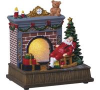 Scène de Noël avec le Père Noël au coin du feu, village de Noël