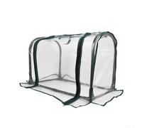 Serre de table compacte en PVC pour les amateurs de jardinage qui gèrent la croissance des plantes dans des espaces résidentiels limités