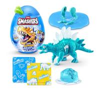 Smashers Mini Jurassic Light Up Dino Ice Age Œuf (Stégosaure) de ZURU - Jouet Dinosaure Cassable avec 6+ Surprises, Slime & Slime Cube de Glace, Dino Lumineux pour Enfants 3+