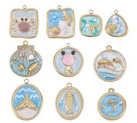 SUNNYCLUE 1 boîte de 10 breloques Émaillées Représentant un Dauphin un Coquillage une Queue de Poisson et un Crabe en Acier Inoxydable Plaqué Or 18K Véritable avec Anneaux de Jonction pour la Création