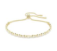 Swarovski Bracelet Tennis de la collection Matrix, avec une alternance de petits et moyens cristaux incolores de taille ronde, fermoir boule coulissante, placage de ton or