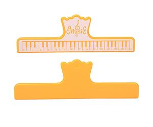 Sxhlseller Pinces à Notes pour Livres de Musique, 2 Pièces en Plastique pour Partitions et Performances d'instruments, Légères, Imperméables, Réutilisables, Jaune, Noir (YELLOW)