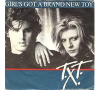 T.X.T. - Girl's Got A Brand New Toy [7", NL, CBS CBSA 6073]