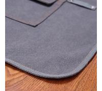 Tablier de travail en toile épaisse imperméable avec fond fendu résistant à l'usure et plusieurs poches pour une meilleure organisation des outils, conçu pour le travail du bois, le jardinage et les