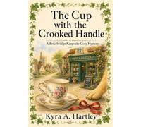The Cup with the Crooked Handle: A Clean English Village Cozy Mystery with an Amateur Sleuth, a Curious Dog, and a Keepsake Shop Secret