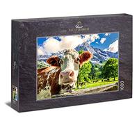 Ulmer Puzzleschmiede - Puzzle Vaches et Montagnes: Puzzle 1000 pièces - Une Vache curieuse Devant Un Paysage de Montagne de rêve dans Les Alpes.