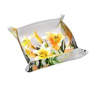 Un bouquet de lys jaunes plateau de rangement en cuir, porte-clés, pièces de monnaie, montres, boucles d'oreilles et autres accessoires, un must have pour la maison