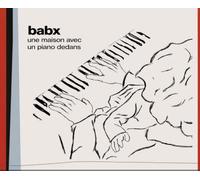 Un piano avec une maison dedans CD