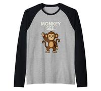 Un Singe drôle voit Un Dicton avec Un Singe de Dessin animé Qui agite Manche Raglan