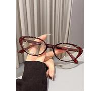 Une paire de lunettes multicolores œil de chat pour femme avec monture en polycarbonate solide et plein cadre personnalisé en épingle. Verres plats tendance
