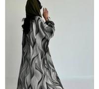 Une pièce de vêtement féminin mode et simple du Moyen-Orient. C'est une robe longue de couleur unie avec des imprimés rétro numériques et des sangles nouées aux poignets. Cette robe cardigan élégante