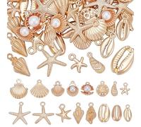 UNICRAFTALE Lot de 80 Pièces de Charmes Océan Dorés Assortis 16 Styles Ensemble de Pendentifs Métalliques Vie Marine Coquillages étoile de Mer Conque Style Tibétain pour Création de Bijoux