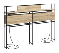 vidaXL Tête de lit Moderne en chêne Sonoma de 140 cm, en Bois reconstitué et Acier. Elle a Une Station de Chargement intégrée, des étagères spacieuses, des Pieds antidérapants, et se Fixe au Mur. C'e