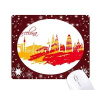 ville silhouette rouge et jaune de barcelone tapis de souris en hiver flocon de neige