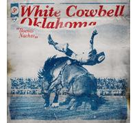 White Cowbell Oklahoma – Buenas Nachas