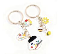 YAZWUR Set de 2 porte-clés pour femme - charms de sac mignons, marguerite-miel & chiot artiste, alliage de zinc (or & argent)