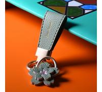 Zorratin Porte-clés en cuir véritable pour femme et fille, porte-clés de voiture avec un anneau en métal orné d'un joli badge pétales